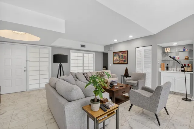 a living room with furniture and a table