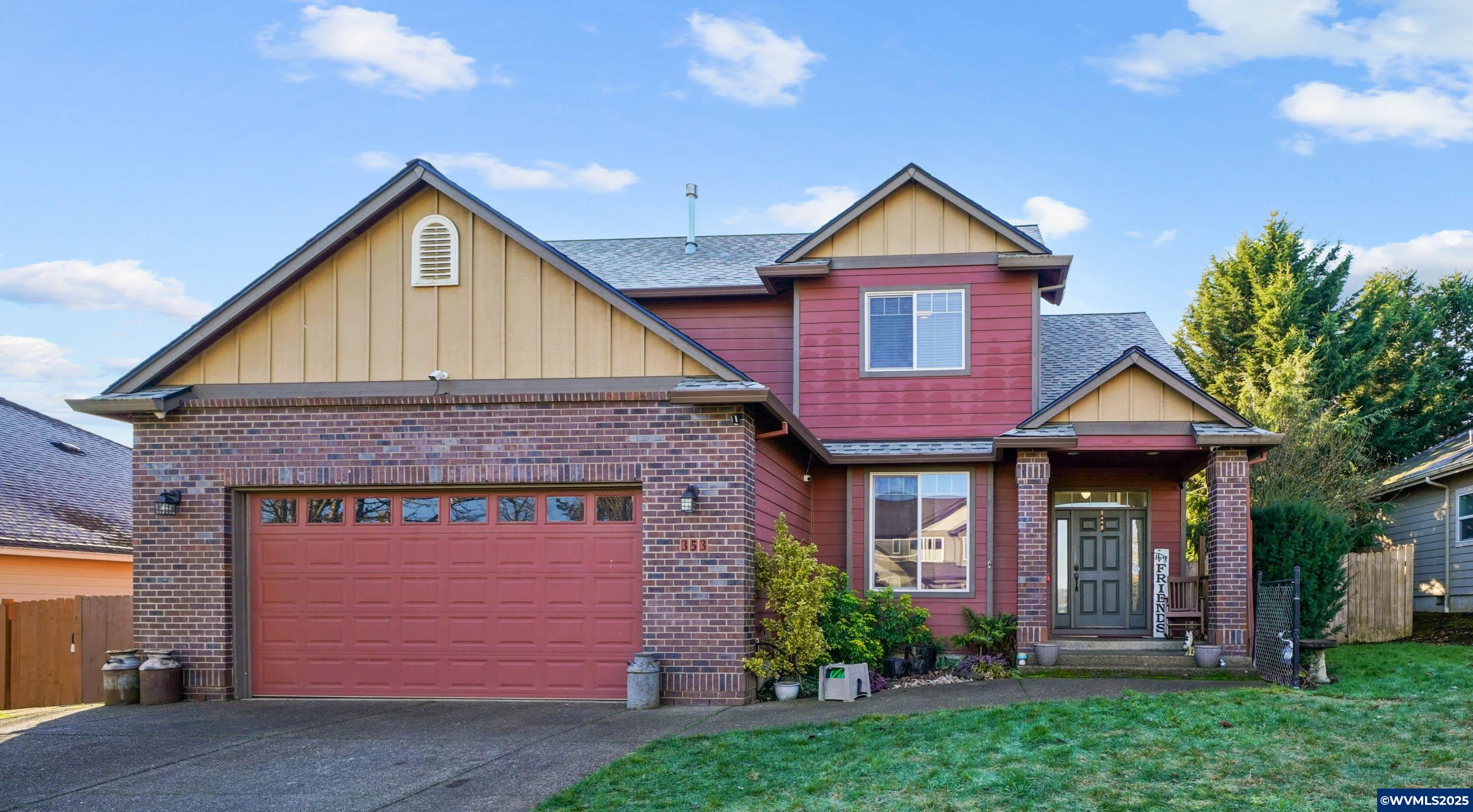 353 Northwest Reed Lane Dallas, OR 97338 - Photo 1 of 45 a front view of a house with garden