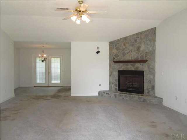 5920 Jack Stokes Road Baker, FL 32531 - Photo 3 of 10 Living area w/ fireplace