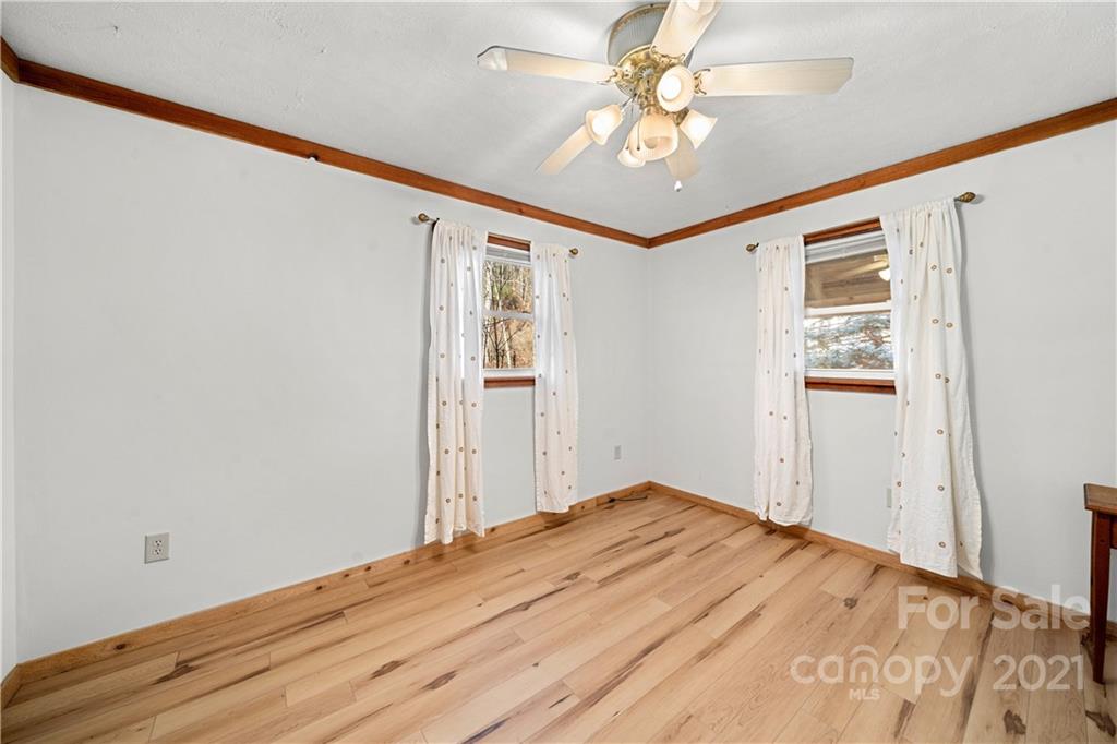 1595 Kitchens Branch Road Sylva, NC 28779 - Photo 22 of 45 a view of empty room with wooden floor
