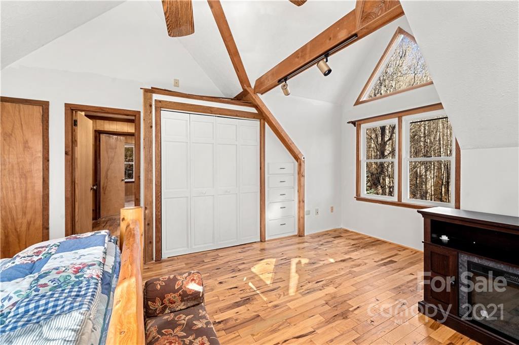 1595 Kitchens Branch Road Sylva, NC 28779 - Photo 26 of 45 a bedroom with a bed and a window