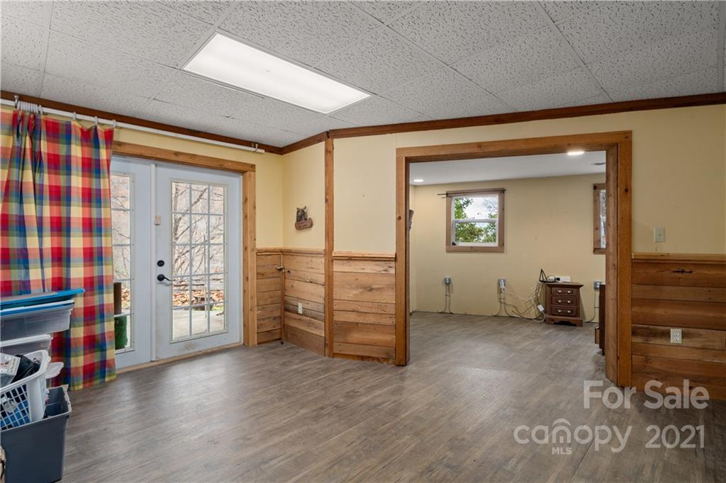 1595 Kitchens Branch Road Sylva, NC 28779 - Photo 38 of 45 a view of an empty room with a fireplace and a window