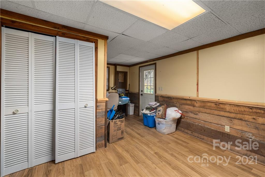 1595 Kitchens Branch Road Sylva, NC 28779 - Photo 40 of 45 a room with a table and chairs and wooden floor