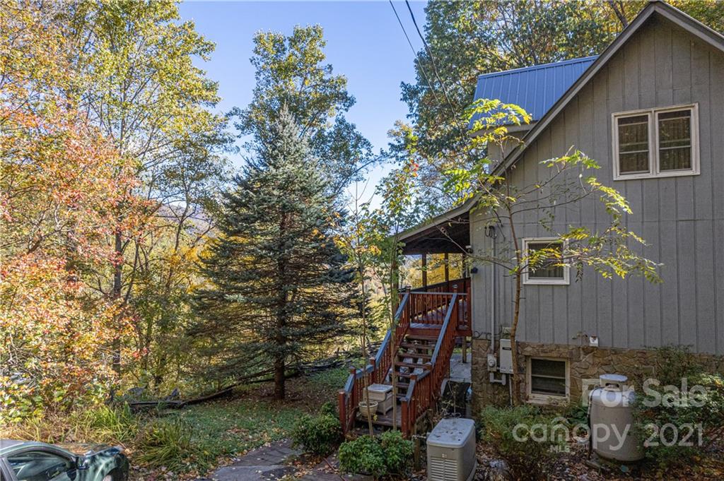 1595 Kitchens Branch Road Sylva, NC 28779 - Photo 5 of 45 a aerial view of a house with a yard and potted plants