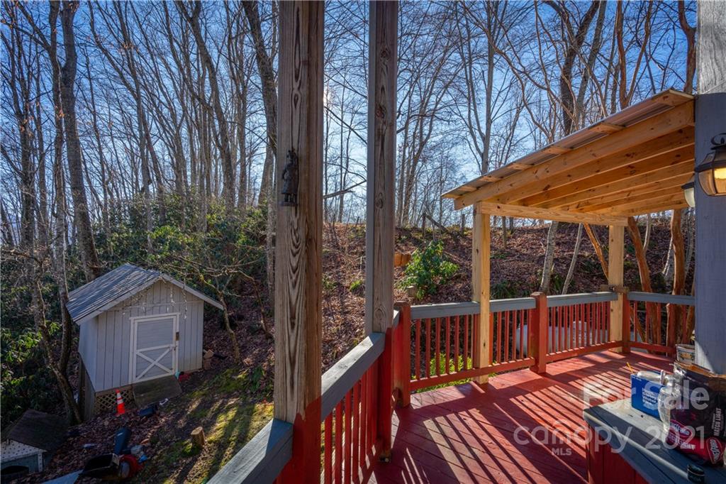 1595 Kitchens Branch Road Sylva, NC 28779 - Photo 9 of 45 a view of a chairs on the roof deck
