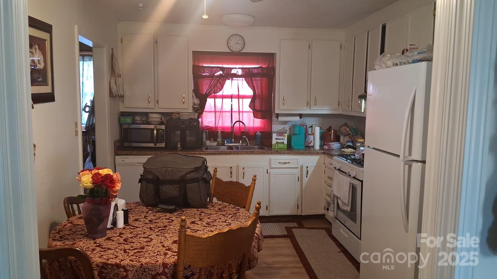 208 Panaview Drive Gaffney, SC 29341 - Photo 13 of 24 a kitchen with a refrigerator and a stove top oven