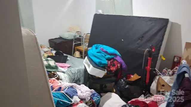 a living room with furniture and flowers