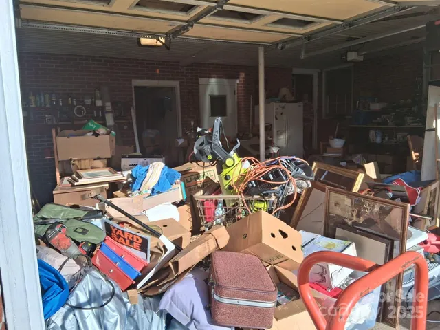 a living room with furniture a rug and a flat screen tv