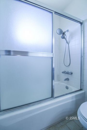 432 Debra Lane Ridgecrest, CA 93555 - Photo 33 of 39 a bathroom with a bathtub and a shower