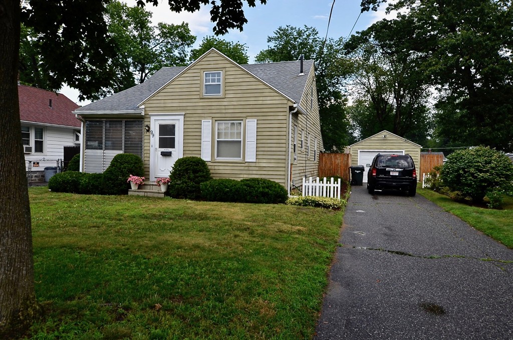 99 Merrimac Avenue Springfield, MA 01104 - Photo 1 of 23 a front view of a house with a garden
