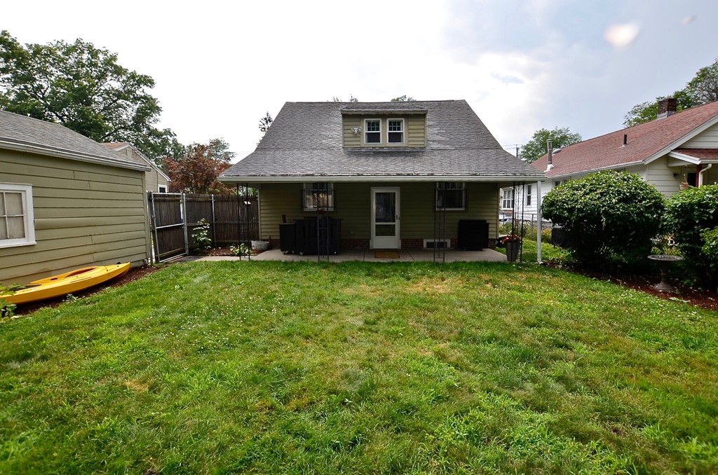 99 Merrimac Avenue Springfield, MA 01104 - Photo 18 of 23 a front view of a house with a yard