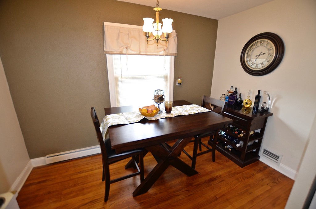 99 Merrimac Avenue Springfield, MA 01104 - Photo 21 of 23 a view of a dining room with furniture and wooden floor