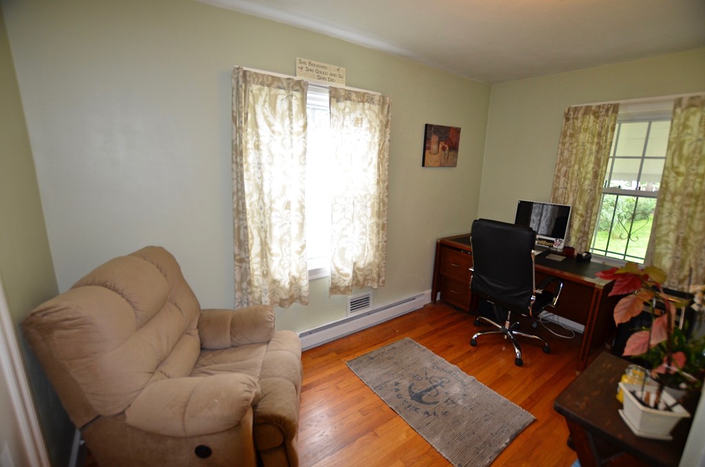 99 Merrimac Avenue Springfield, MA 01104 - Photo 6 of 23 a living room with furniture and a window