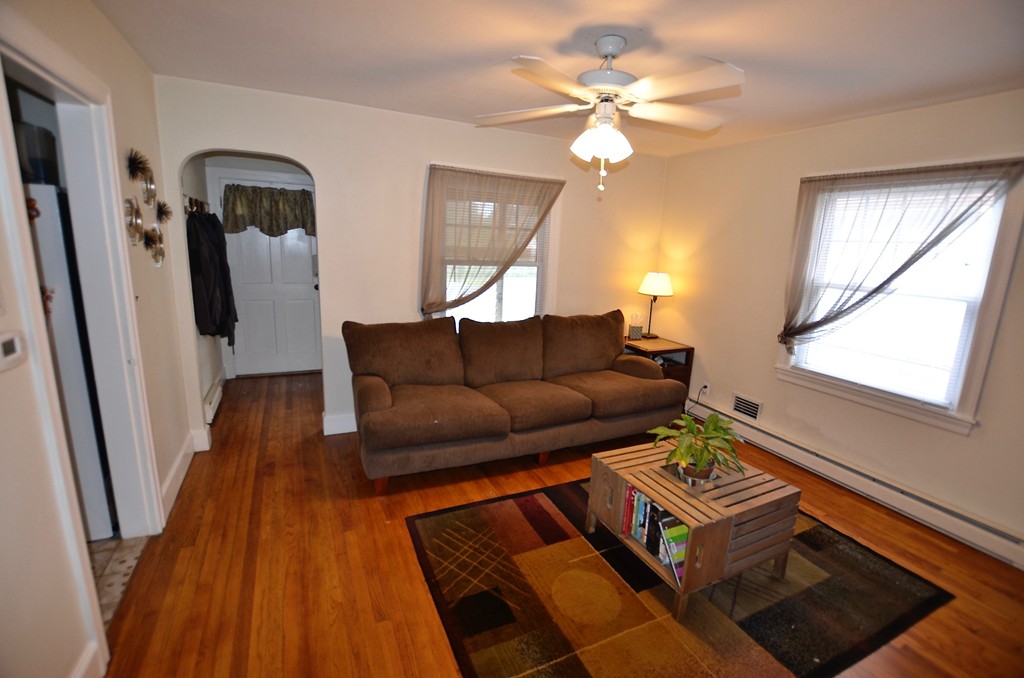 99 Merrimac Avenue Springfield, MA 01104 - Photo 8 of 23 a living room with furniture and a window