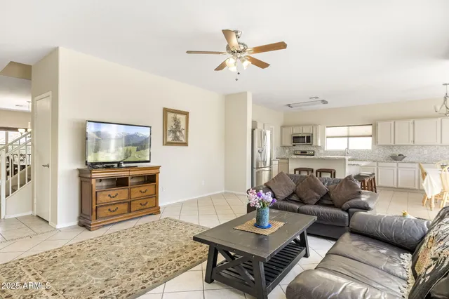 a kitchen with a table chairs and a refrigerator