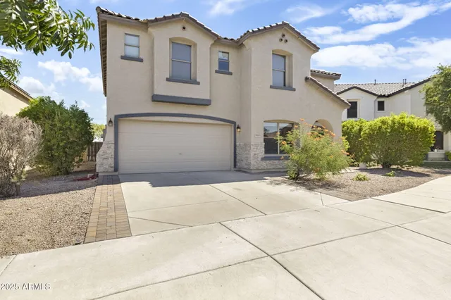 a front view of a house with yard