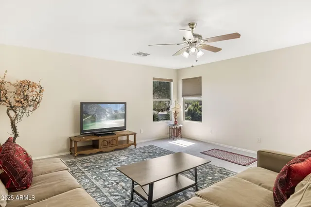 a living room with furniture and a rug