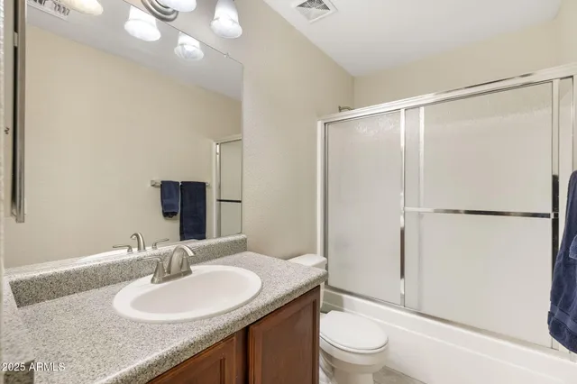 a bedroom with bed and a window