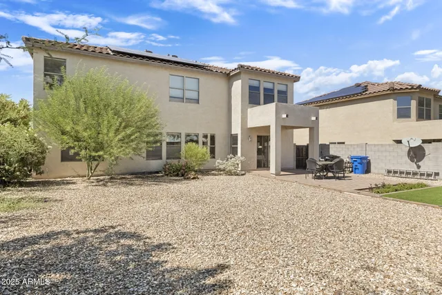 a view of patio with swimming pool