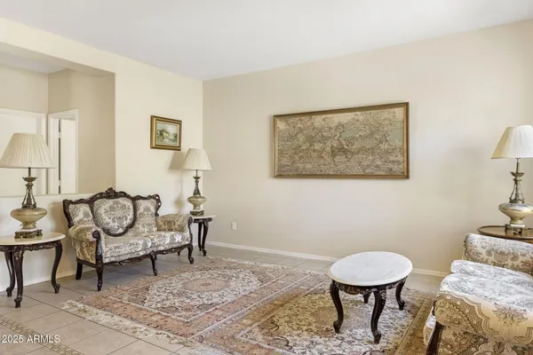 a living room with furniture and a rug
