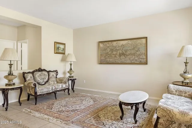 a living room with furniture and a rug