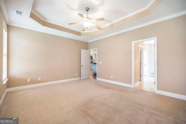 a bathroom with a double vanity sink a mirror and a bathtub