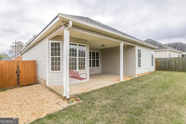 a house that has a big yard in front of it