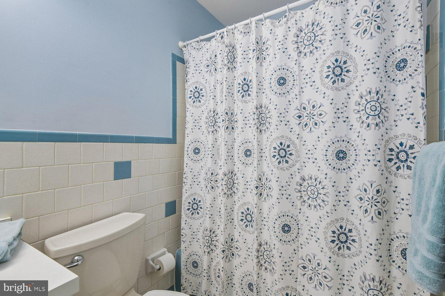 1518 Winchester Road Annapolis, MD 21409 - Photo 40 of 70 a bathroom with a toilet and a shower curtain