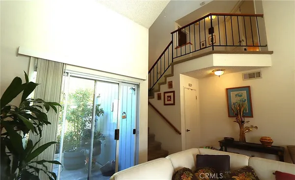 a bedroom with furniture and a chandelier