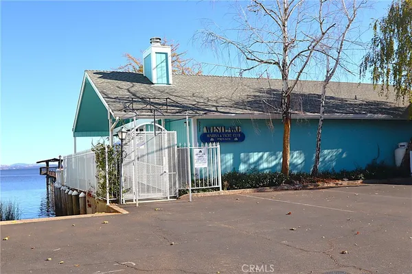 a view of a house with swimming pool and sitting area