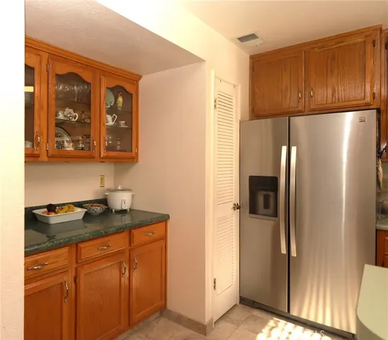 a bathroom with a sink mirror and toilet