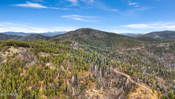 a view of mountain view with mountains in the background