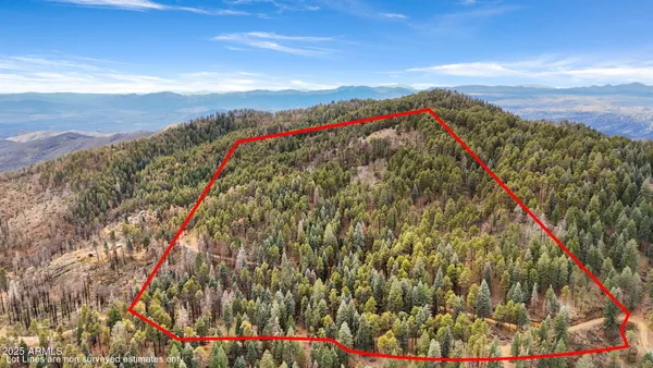 a view of a mountain range in a cloudy sky