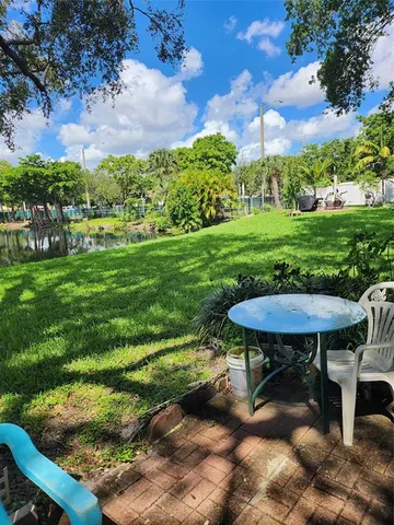 a view of swimming pool with a yard