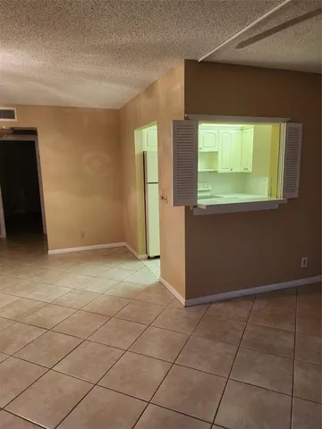 a view of a kitchen with furniture and a window