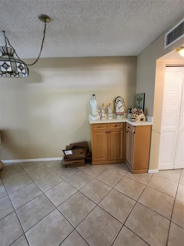 a kitchen with a refrigerator a sink and a stove