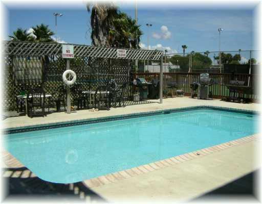 14741 Compass Street Corpus Christi, TX 78418 - Photo 2 of 2 a view of a house with a swimming pool