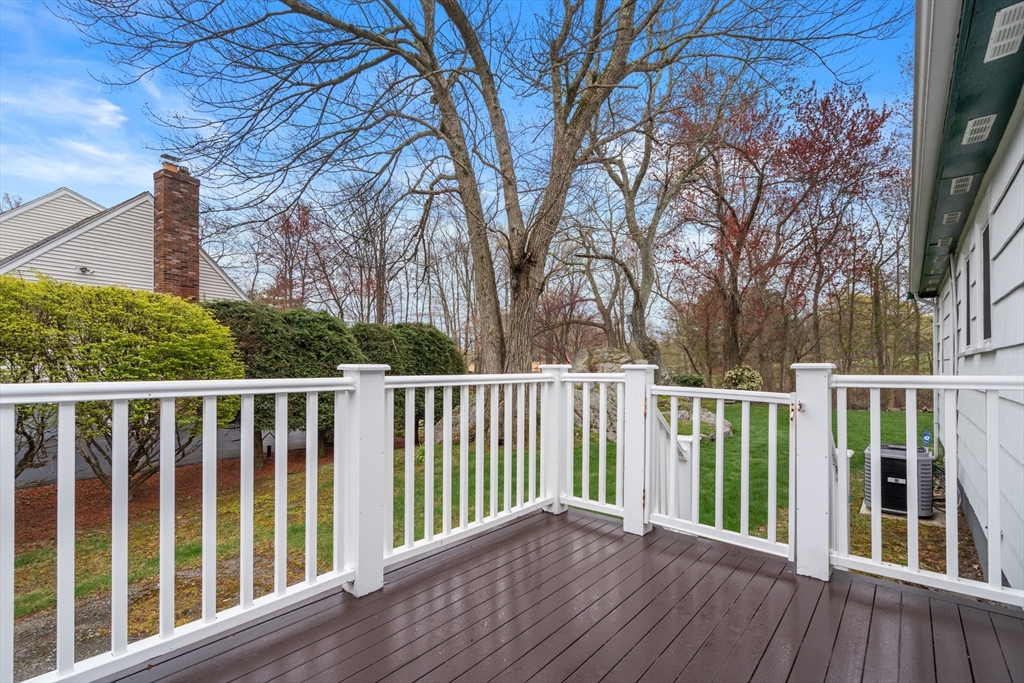 125 Lyman Road Milton, MA 02186 - Photo 21 of 25 a balcony with wooden floor and fence