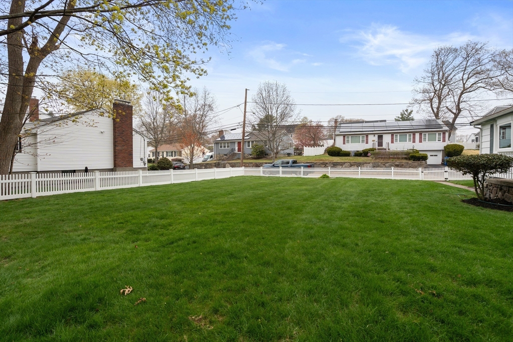 125 Lyman Road Milton, MA 02186 - Photo 22 of 25 a house view with a sitting space and garden