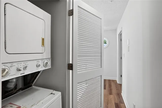 a view of a yard with plants and trees