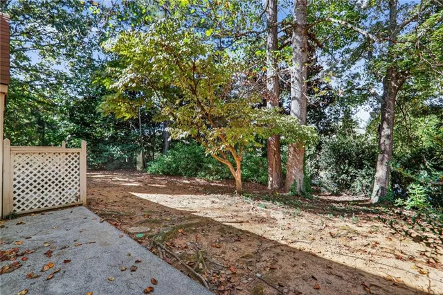 a front view of a building with a yard