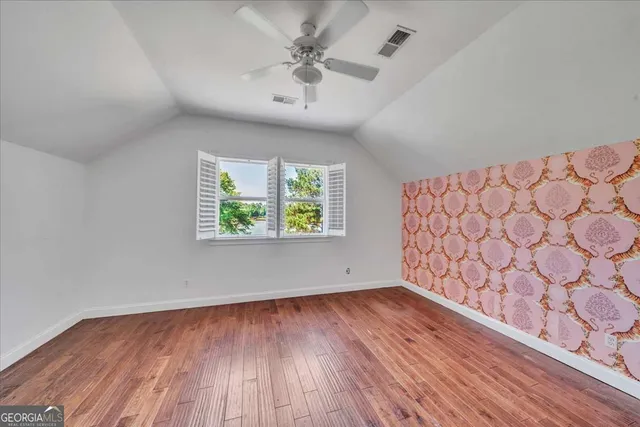 a view of a porch with wooden floor and outdoor space