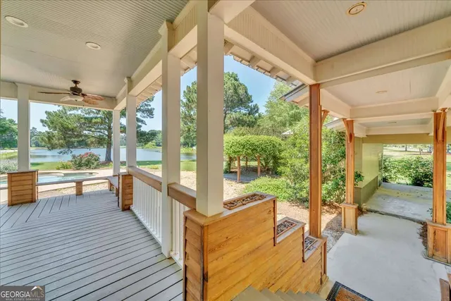 a view of a swimming pool with a yard