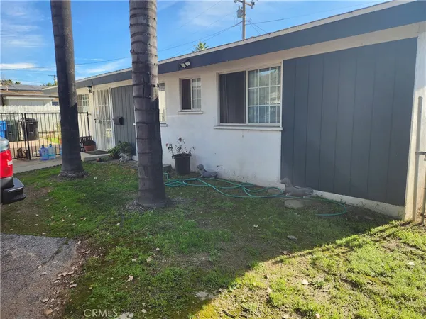 a backyard of a house with seating space