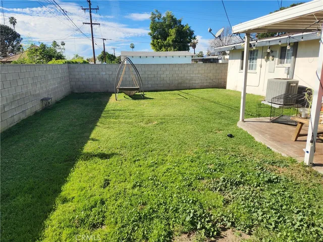 a view of a backyard with sitting area