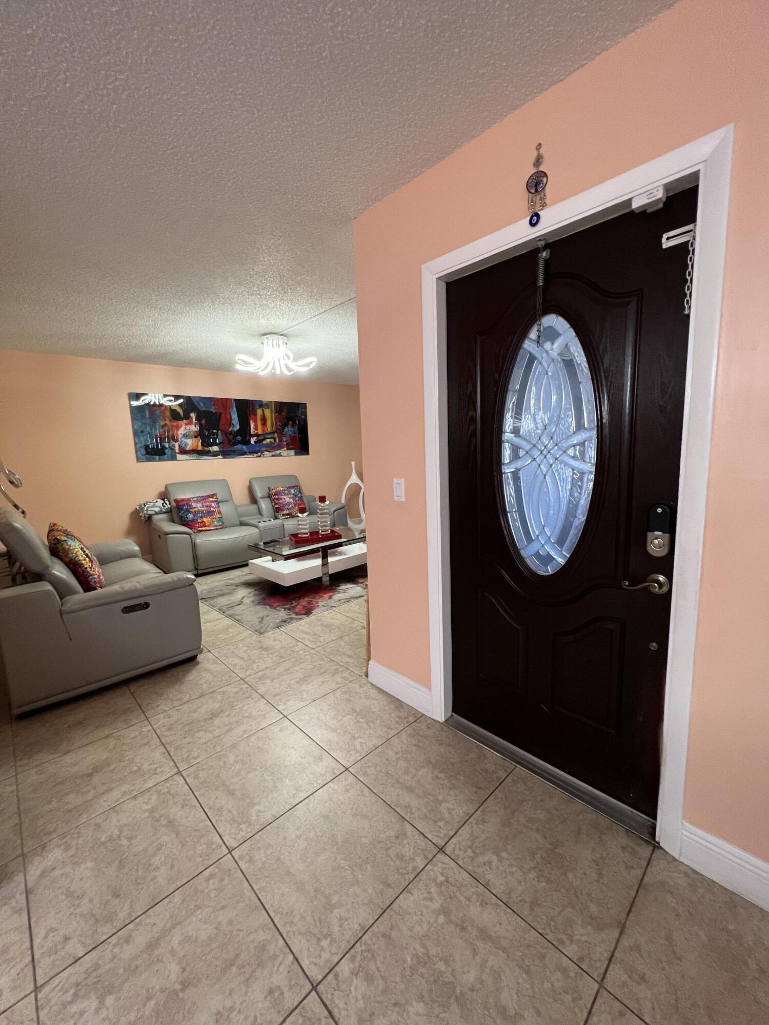 411 Arabian Road Palm Springs, FL 33461 - Photo 26 of 29 Front door