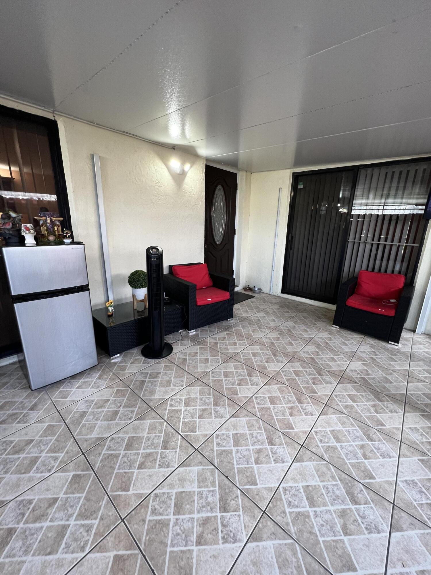 411 Arabian Road Palm Springs, FL 33461 - Photo 28 of 29 Covered Patio