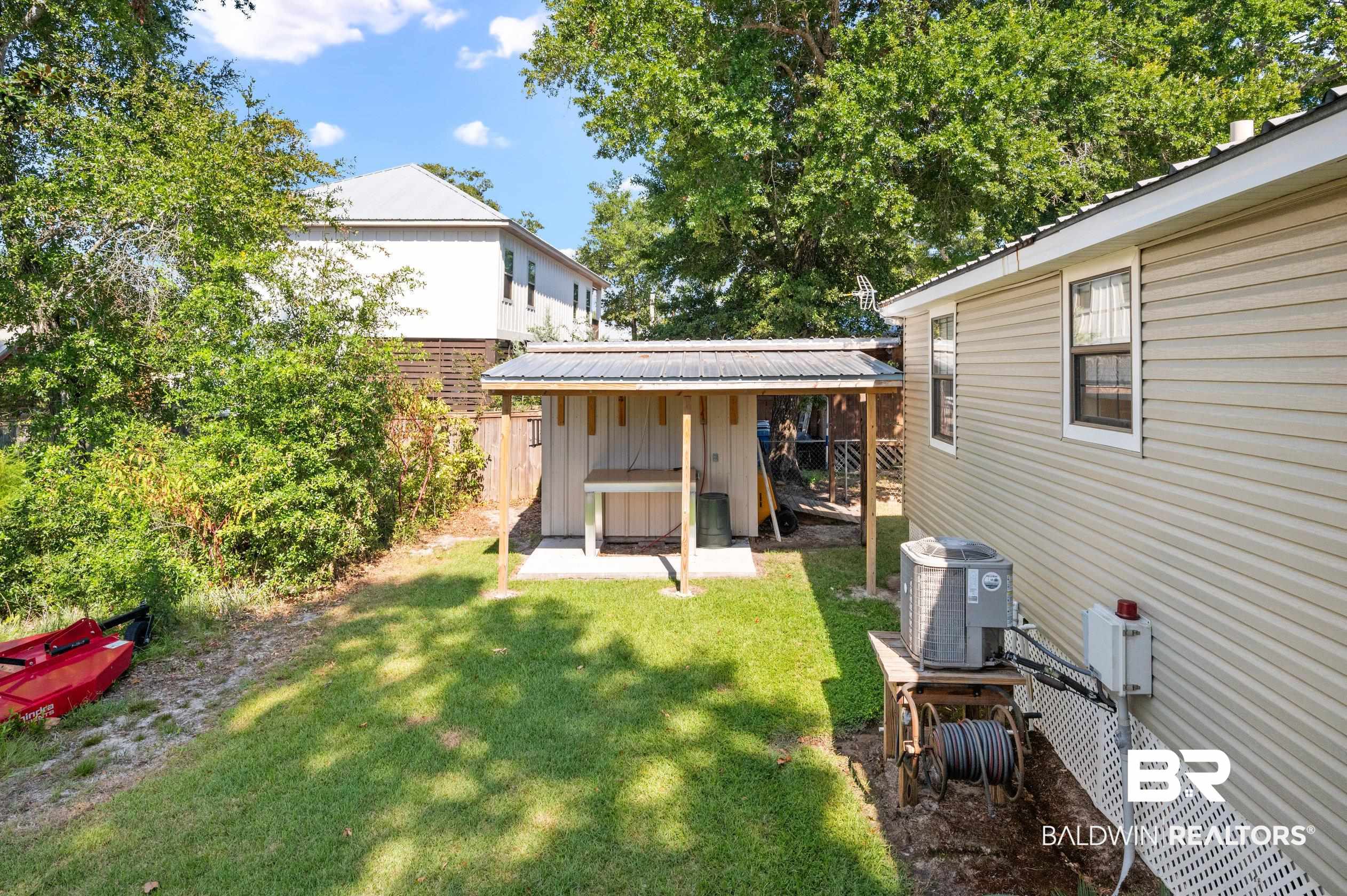 5392 Ornacor Avenue Orange Beach, AL 36561 - Photo 27 of 48 View of yard with central AC unit