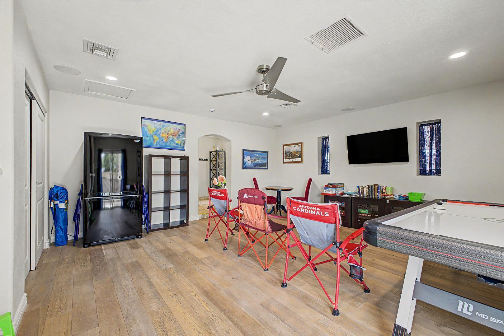 3346 East Cochise Road Phoenix, AZ 85028 - Photo 6 of 40 a living room with furniture and flat screen tv