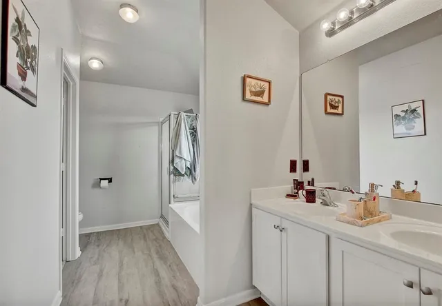 a bathroom with a tub and a shower